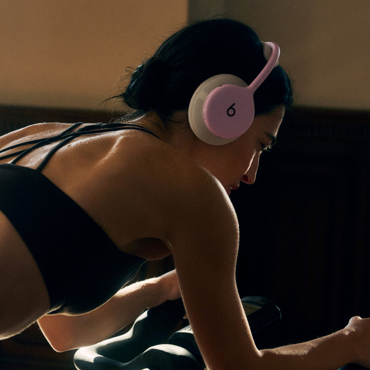 Person wearing Beats 360 headphones in Pink 